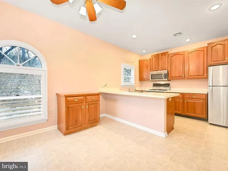 Kitchen and dining area with arched windows